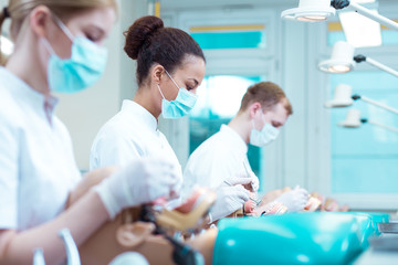 Three stomatology students