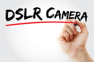 Hand writing DSLR camera with marker, concept background