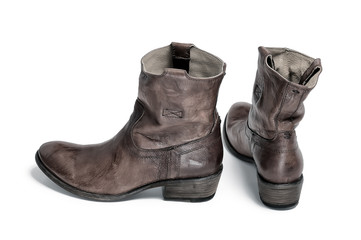 Pair of traditional cowboy boots retro tone