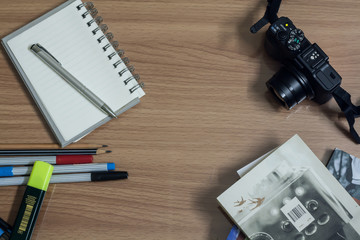 workplace with camera,pen and notepad,diary
workplace with camera,pen and notepad,diary on a table with colour.
