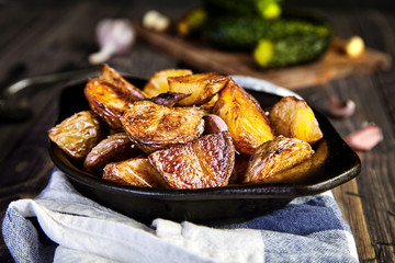 Baked potato wedges with garlic, christmas garnish