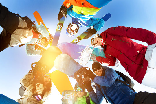 Group friends snowboarders skiers snowboarding skiing