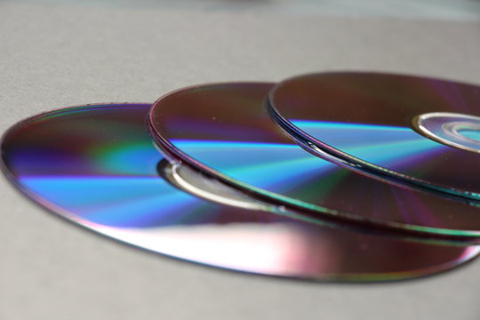 compact discs on a dark background