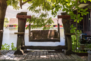 Fototapeta na wymiar Wooden bench in summer