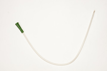 an intermittent transparent catheter isolated over a white backg