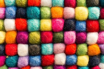 Geometric background with balls of colored synthetic wool