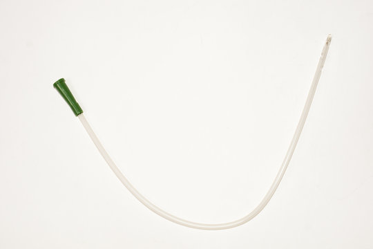 An Intermittent Transparent Catheter Isolated Over A White Backg