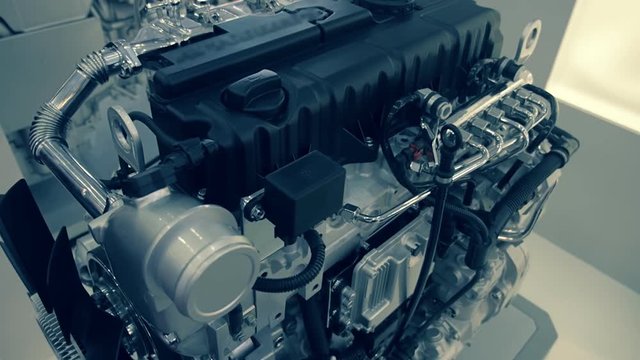 Powerful internal combustion engine stands on the pedestal and shining of chrome surface