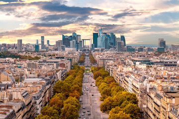 La Defense Financial District Paris France in autumn. Traffic on Champs-Elysees with orange and...