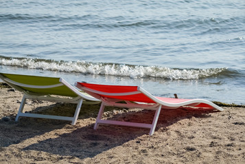 Two sunbeds on the beach