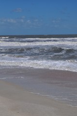 Waves on the beach and blue sky
