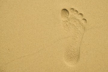 Fototapeta na wymiar single footprint on the beach at phuket