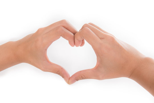 Hands as a hart shape on white background - love concept
