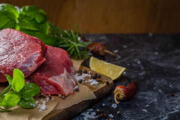 Raw beef meat with herbs and spices
