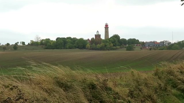 Lighthouse of Cape Arkona at Putgarten. Fields and meadow around. Autumn leave. Baltic sea coast. (Mecklenburg-Vorpommern, Germany). Stormy weather.