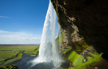 Fototapeta na wymiar Waterfall Seljalandsfoss with rainbow in Iceland.