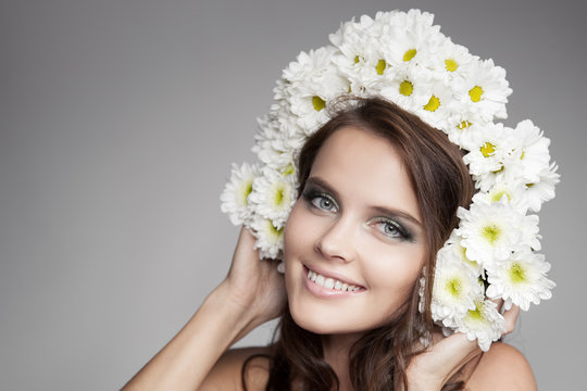 Beautiful Smiling Happy Woman With Fower Wreath On Her Head.