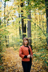 girl in autumn deciduous forest