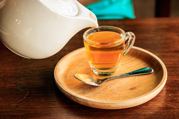 Pour the tea into a glass