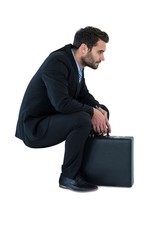 Businessman sitting on steps