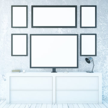 White cupboard with monitor and frames