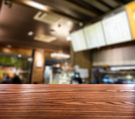 Wood table top on blurred coffee cafe vintage wooden decorate