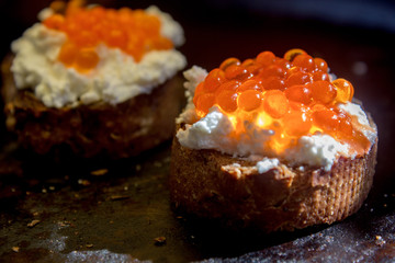 Bruschetta with ricotta cheese and red caviar