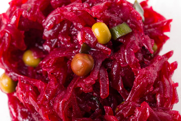 Beetroot salad with green peas.
