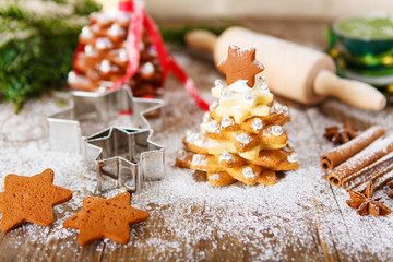 Homemade baked Christmas gingerbread tree on vintage wooden back