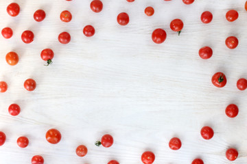 red vegetable frame/ Christmas tree and blank card for lettering hanging from a rope on the background of whitewashed wood © zoomingfoto1712