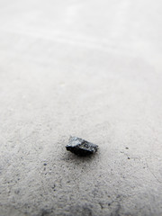 HDR Photo of a small pebble on a concrete surface