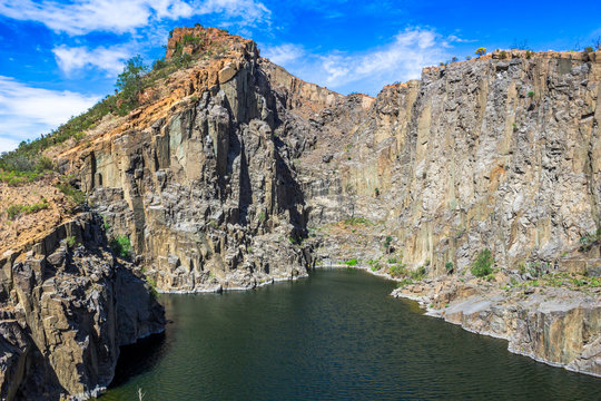 Old unused water filled dolerite rock quarry