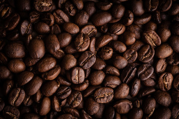 roasted coffee beans on dark background, can be used as a background
