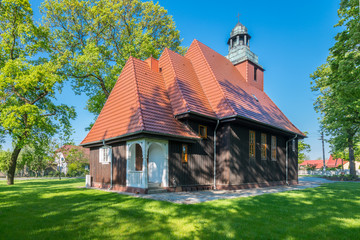 Obraz premium Norwegian wooden church in Krzesiny - Poznan; one of two Norwegian stave wooden churches (stavkirke) in Poland - founded in 1912