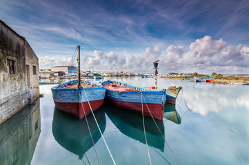 Fishing boats moored on the River. © ajcabeza