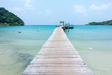 Fototapeta premium old and break sea wood bridge pier to harbor in Koh Kood island