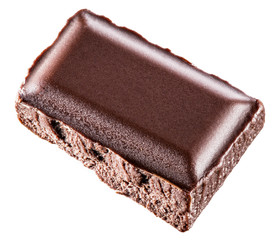 A piece of chocolate bar isolated on a white background.