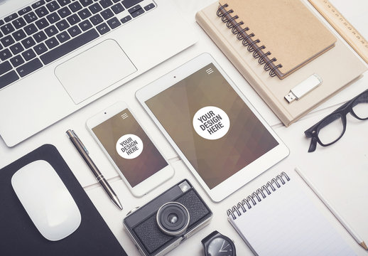 Smartphone and Tablet on a Wooden Desk with Camera and Notebooks Mockup