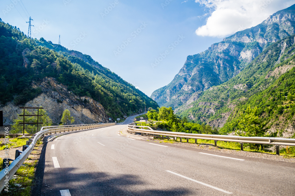 Wall mural empty road in french alps