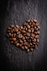 roasted coffee beans on dark background, can be used as a background