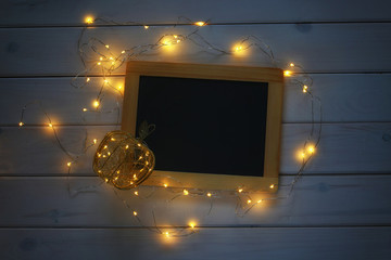 empty blackboard and christmas lights