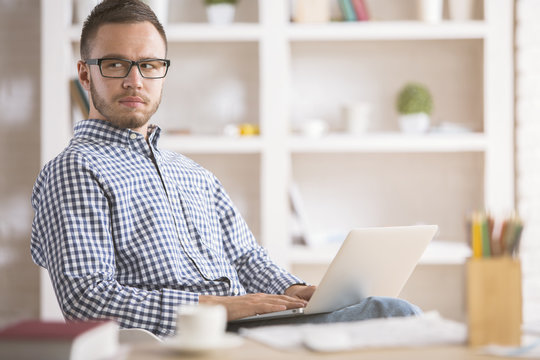 Caucasian man using laptop