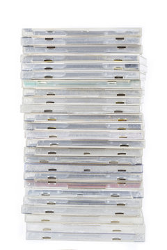 Pile of old compact disc box cd or dvd on white background isola