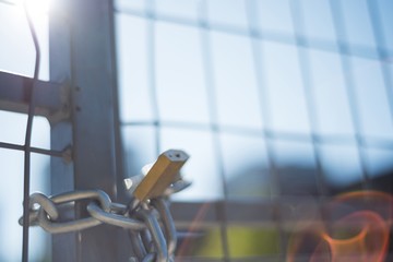 Fence locked with chain and padlock