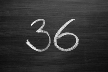 number thirty six enumeration written with a chalk on the blackboard