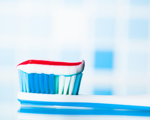 toothbrush with red stripe toothpaste