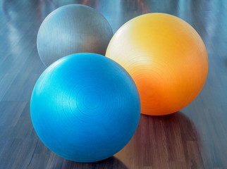 Color filter image, Fitness rubber balls on parquet floor (fitness, ball, yoga) 