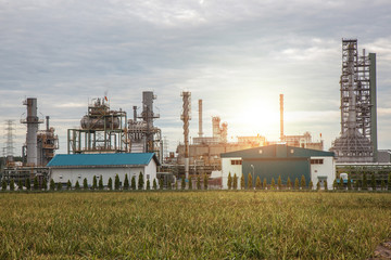Fototapeta na wymiar Oil and gas refinery industry plant, sunset and Chemical storage tanks