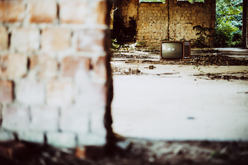 Old television in abandoned building