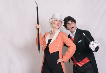 Magician and assistant. Taken on a white background. 